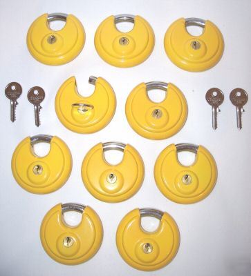 New set of 10 yellow steel disk locks. keyed alike 
