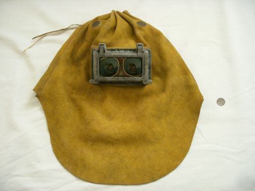 Old leather welder's hood goggles burning steampunk man