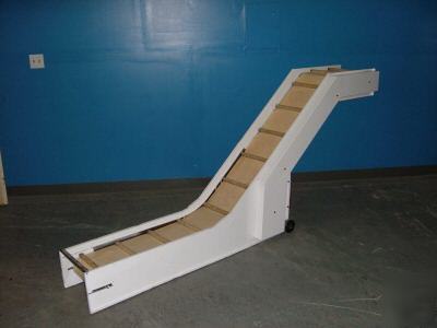 Inclined conveyor. cleated belt. refurbished. tested