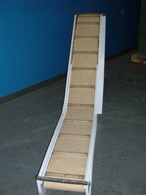 Inclined conveyor. cleated belt. refurbished. tested