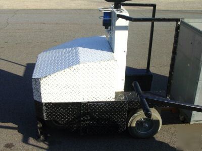 Tci mfg. battery tugger cart and accessories