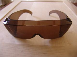 Golden brown safety sunglasses fits over your glasses
