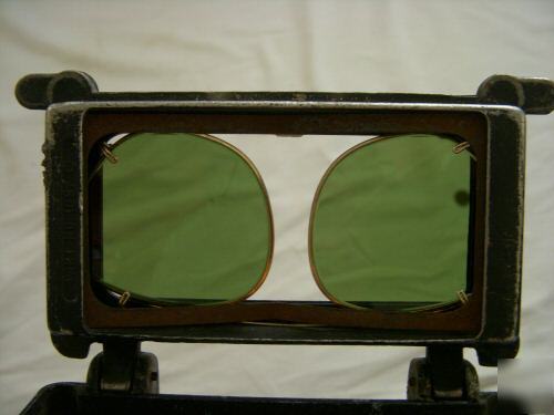 Old leather welder's hood goggles burning steampunk man