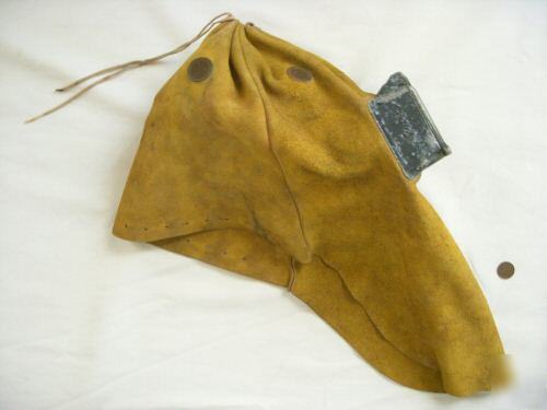 Old leather welder's hood goggles burning steampunk man