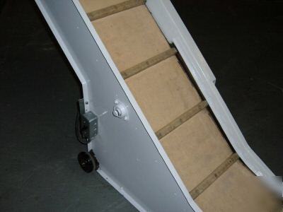 Inclined conveyor. cleated belt. refurbished. tested